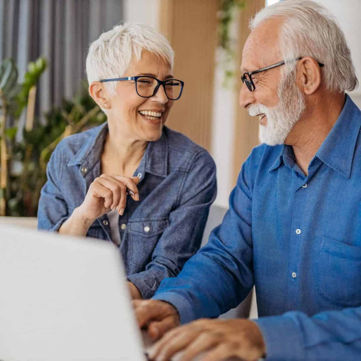 Sublette Precious Metals IRA & Investing Company Copy of Senior couple at laptop smiling GettyImages 1323096524 1200x1200 1