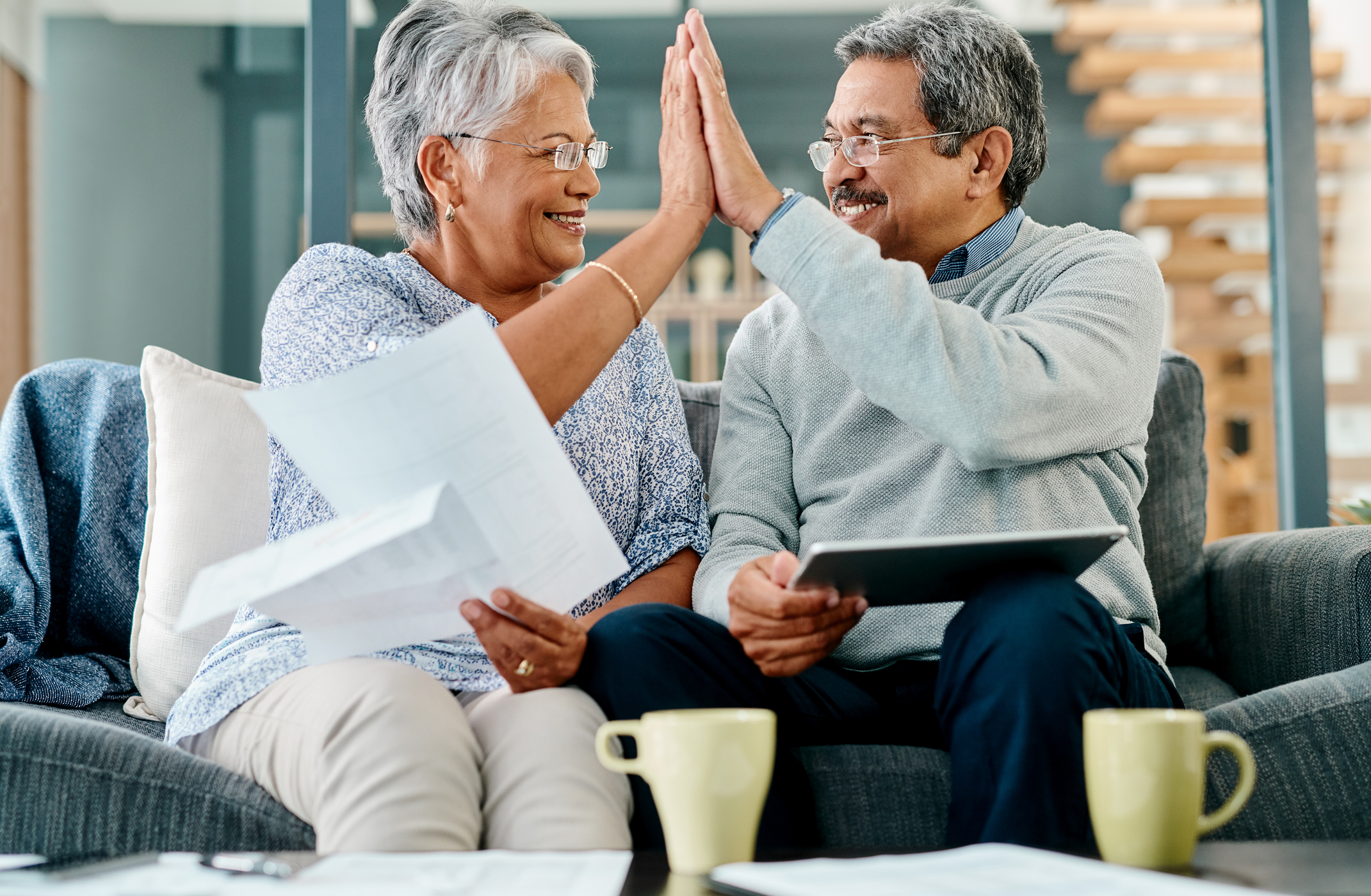 Elburn Gold IRA Investing Company getty couple high five happy